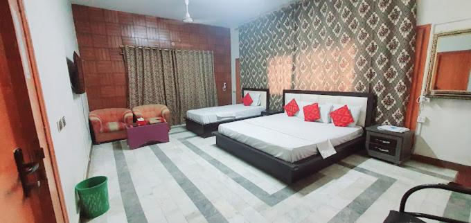 Postel nebo postele na pokoji v ubytování Hotel New View Guest House