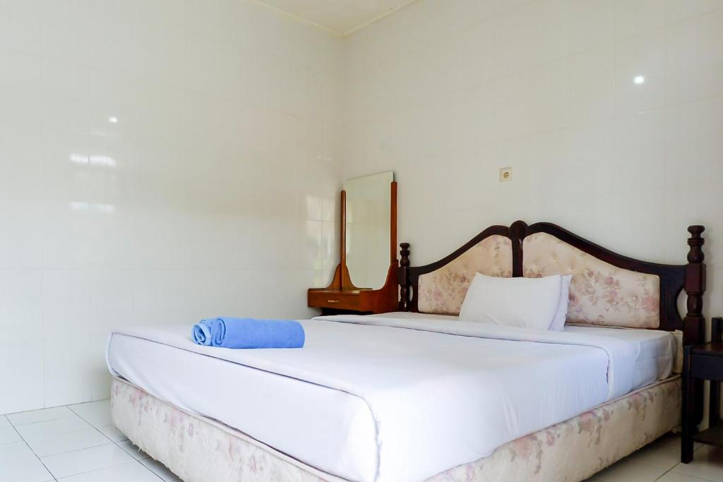 Ένα ή περισσότερα κρεβάτια σε δωμάτιο στο Hotel Segara Kedisan Kintamani