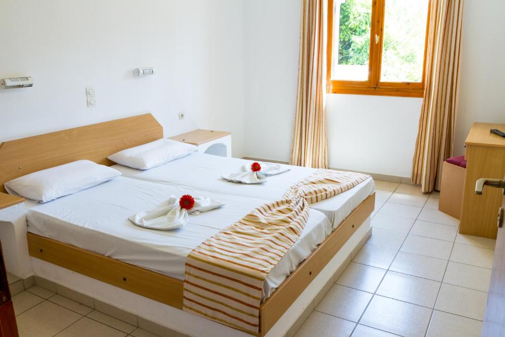 Postel nebo postele na pokoji v ubytování Ideal Hotel