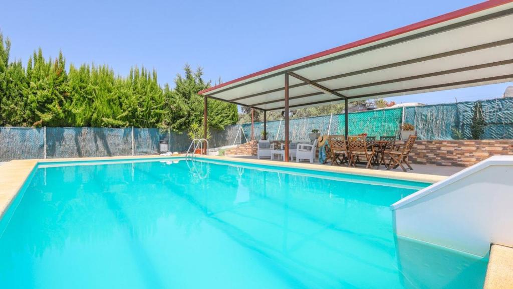 a swimming pool with a canopy over it at Villa Josara by Ruralidays in Huelva