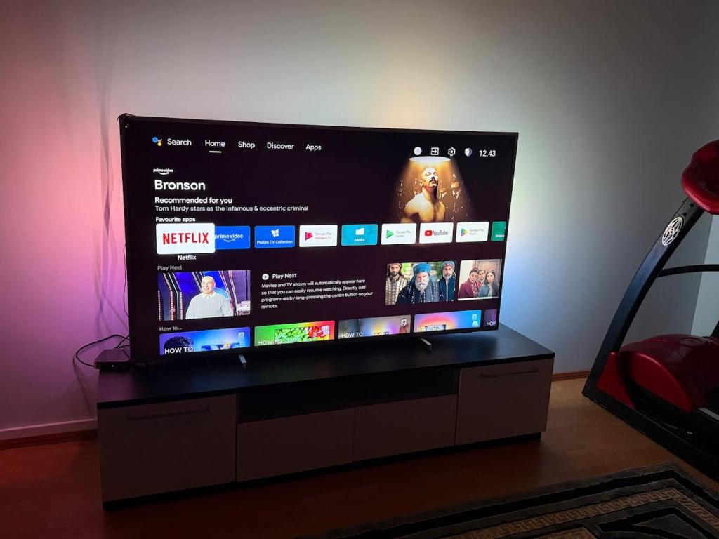 a flat screen tv sitting on top of a stand at A great apartment for daily or weekly rent 60m in Espoo