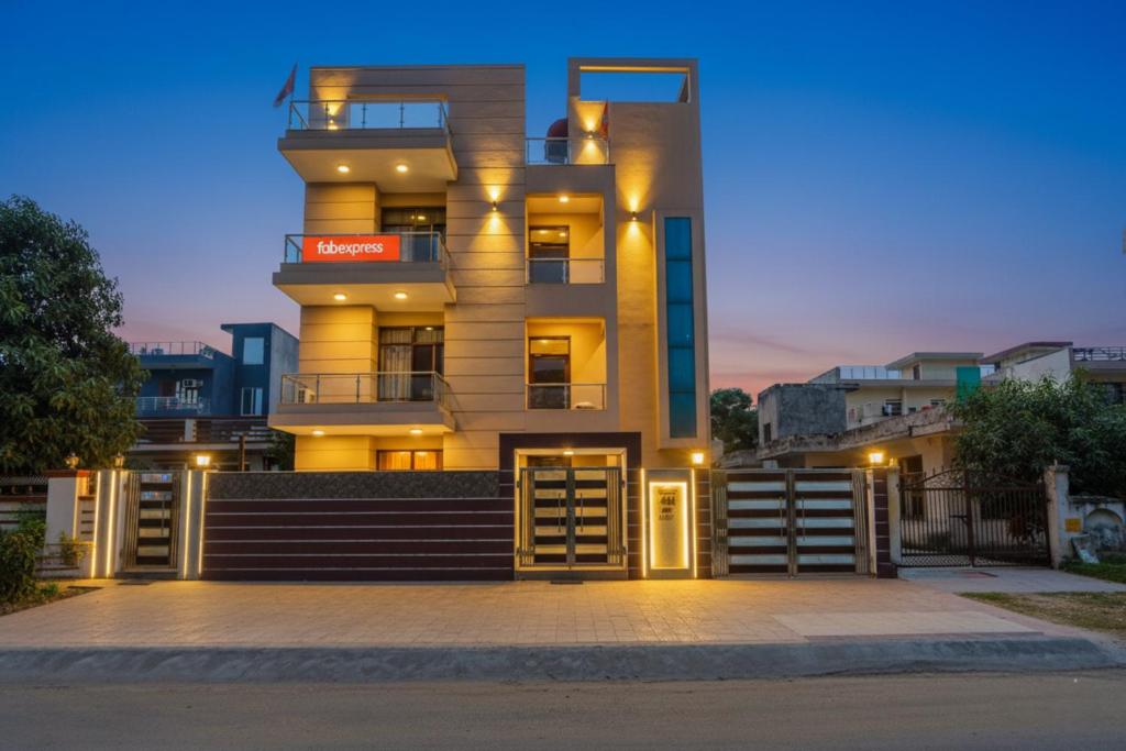 a tall yellow building with a staircase in front of it at Via Next Home - Nr IMT Chowk Manesar in Gurgaon