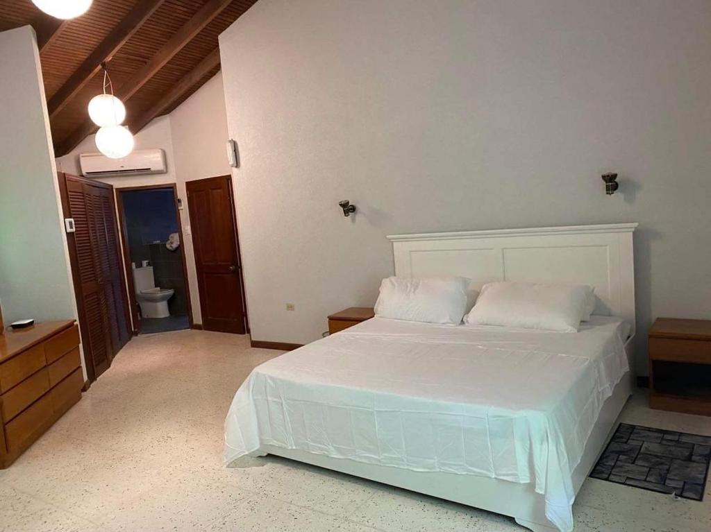 Voodi või voodid majutusasutuse Reef Utopia Tobago toas