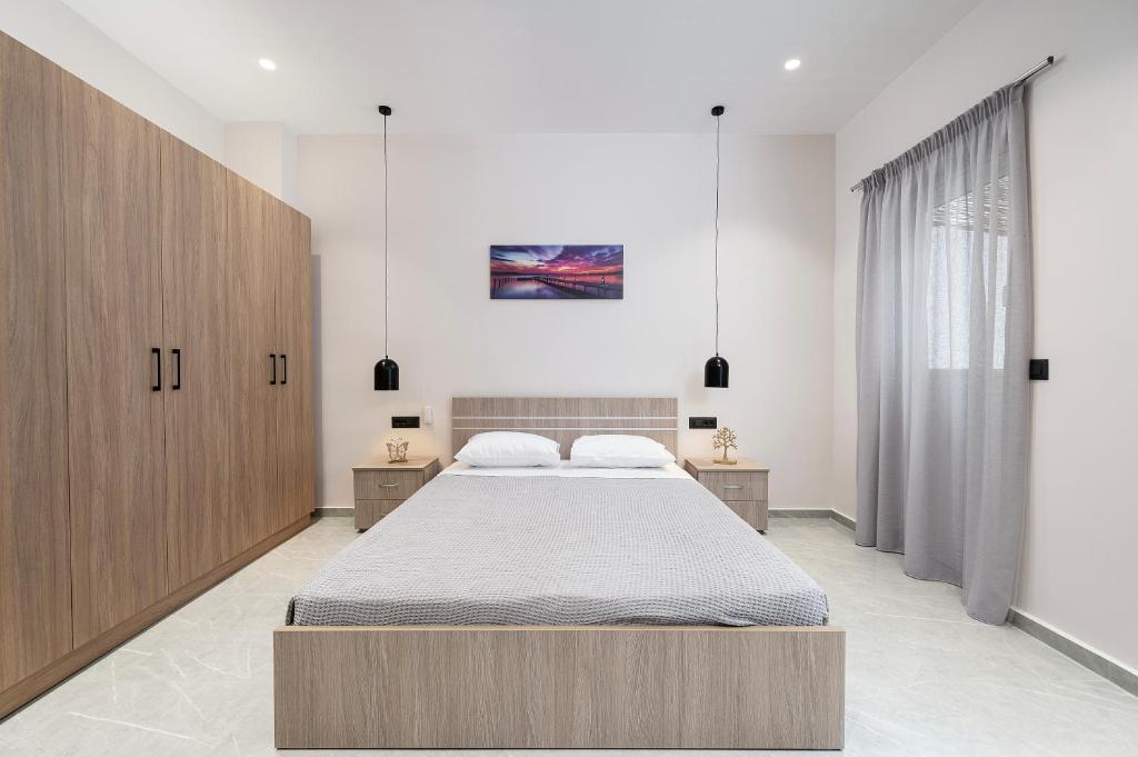 Ένα ή περισσότερα κρεβάτια σε δωμάτιο στο The Saltwater Suite Residence