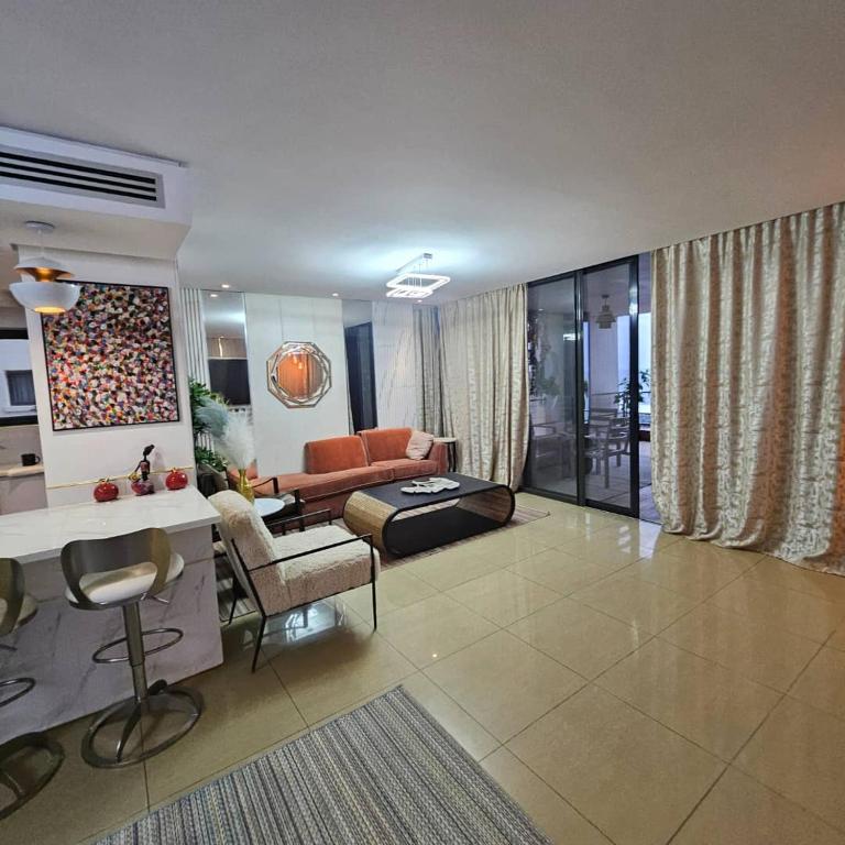 Et opholdsområde på Appartement de Luxe avec vue mer