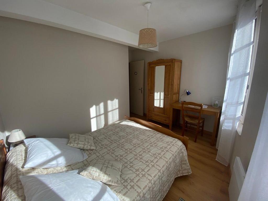 Postel nebo postele na pokoji v ubytování Les Iris