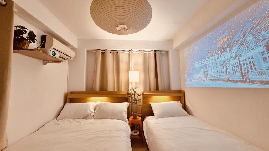 Voodi või voodid majutusasutuse Exit 4 of Hongik University toas