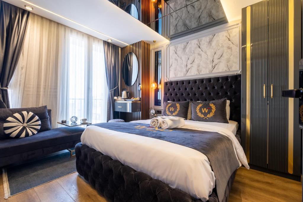 En eller flere senge i et værelse på The Wind Beşiktaş