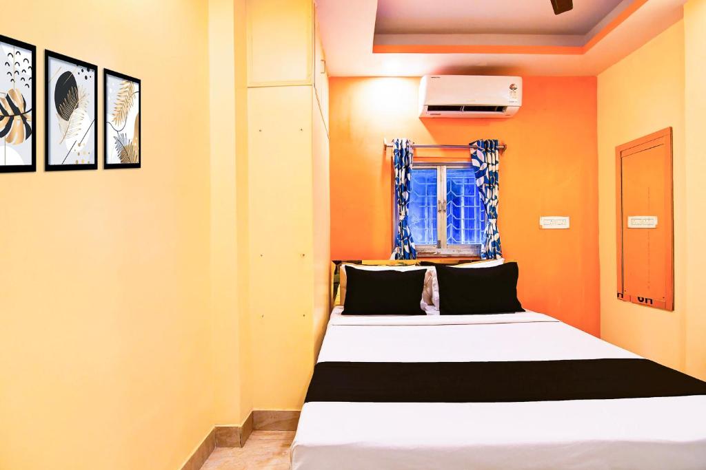 Ένα ή περισσότερα κρεβάτια σε δωμάτιο στο Hotel O CITY PLACE