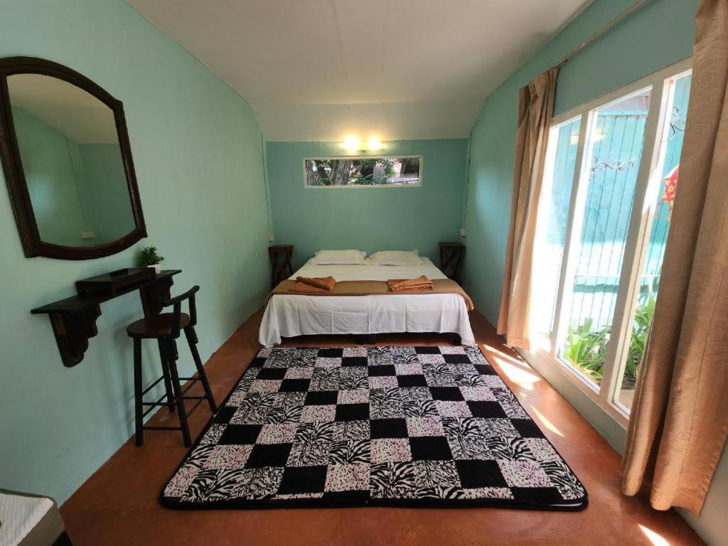 Voodi või voodid majutusasutuse Blissful Garden Chalet Langkawi toas