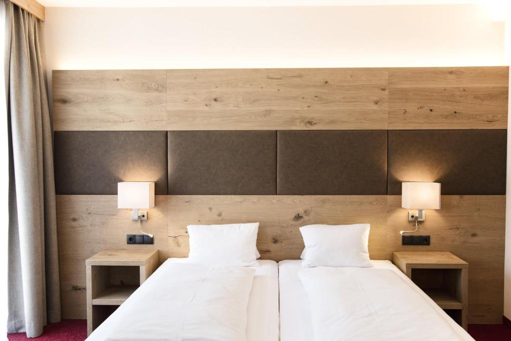 Postel nebo postele na pokoji v ubytování Hotel Andreas Hofer