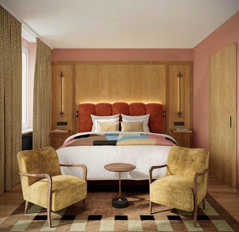 Ένα ή περισσότερα κρεβάτια σε δωμάτιο στο Hotel Alpina Luzern