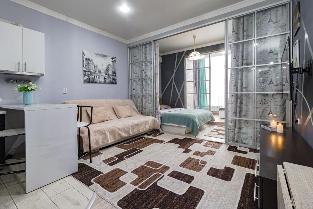 En eller flere senge i et værelse på В центре с дополнительным спальным местом