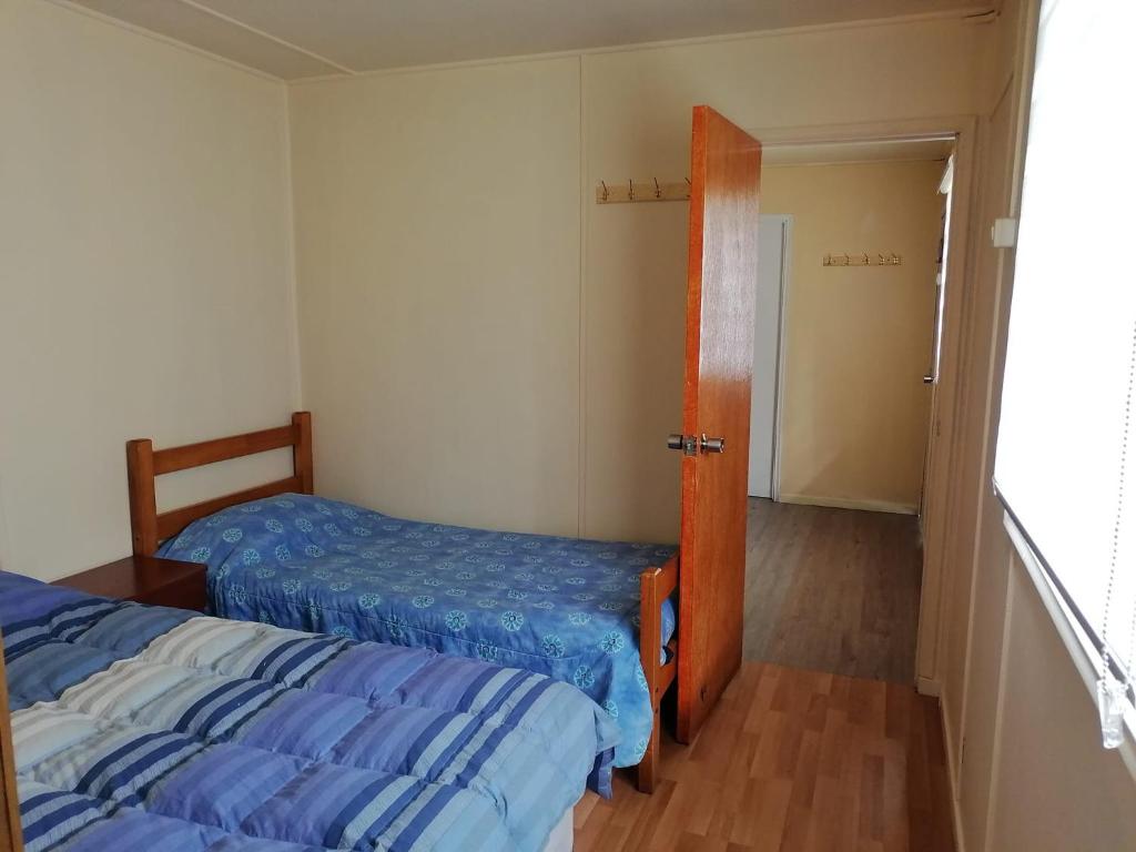 Ένα ή περισσότερα κρεβάτια σε δωμάτιο στο Refugio Amelia