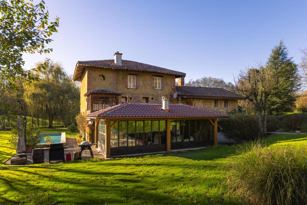 a large house with a gazebo in the yard at Le moulin de Varax in Saint-Paul-de-Varax