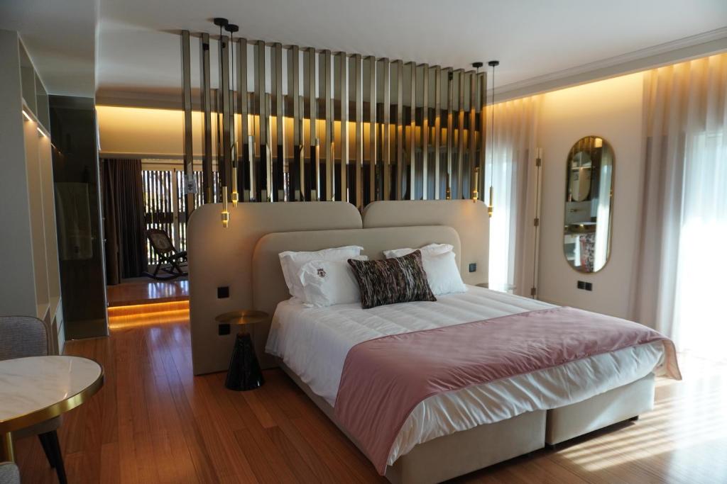 Giường trong phòng chung tại Quinta Solar das Fontes