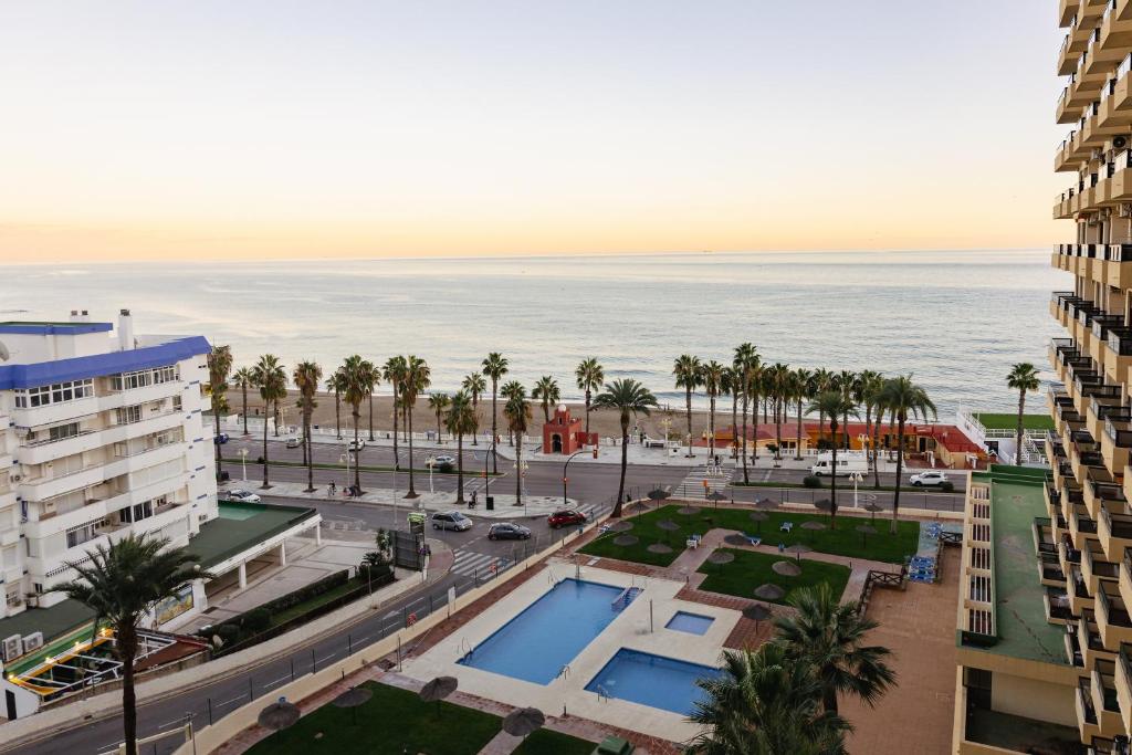 a view of the ocean from a building at Precioso apartamento con vistas al mar in Benalmádena