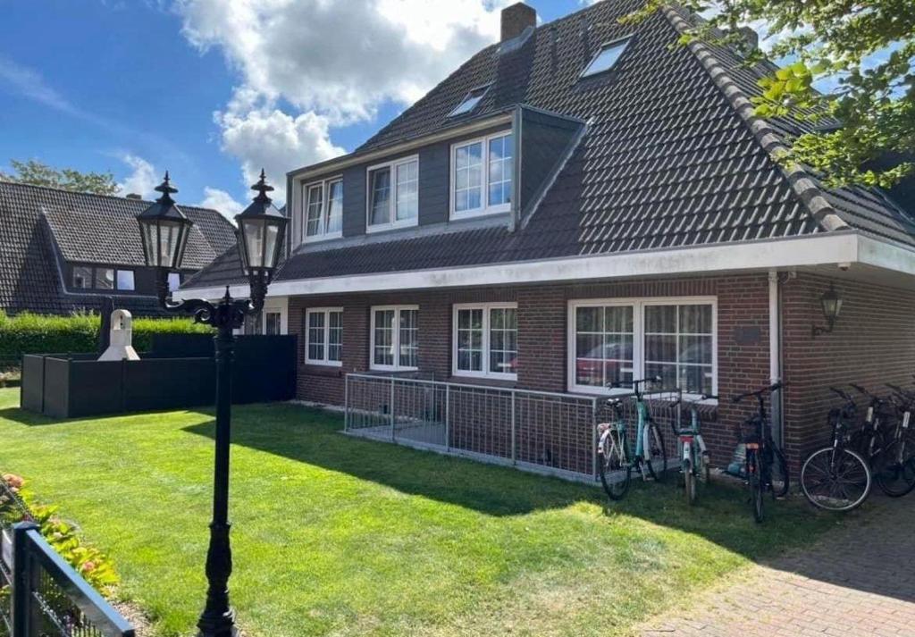 a house with bikes parked outside of it at Seaside-Amrum-11 in Norddorf