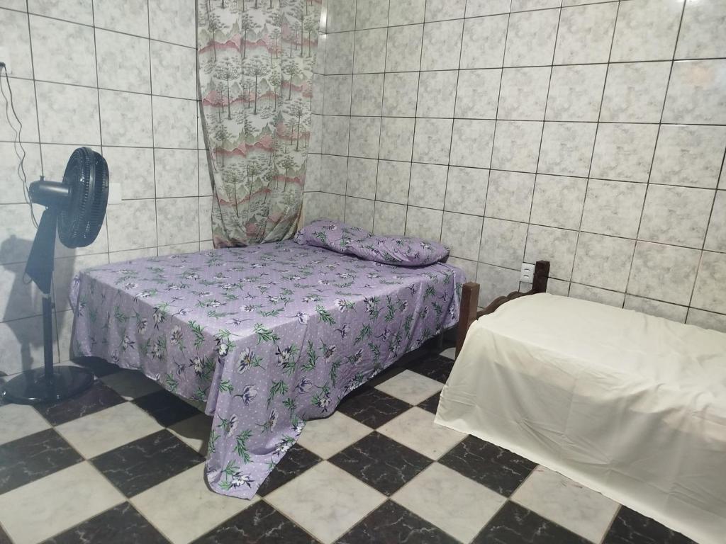 Postel nebo postele na pokoji v ubytování Hospedagem Casa grande