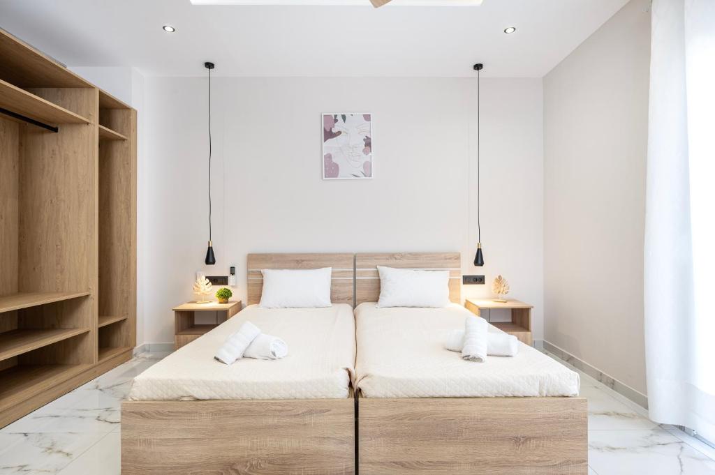 Postel nebo postele na pokoji v ubytování The Neptunian Suite Residence