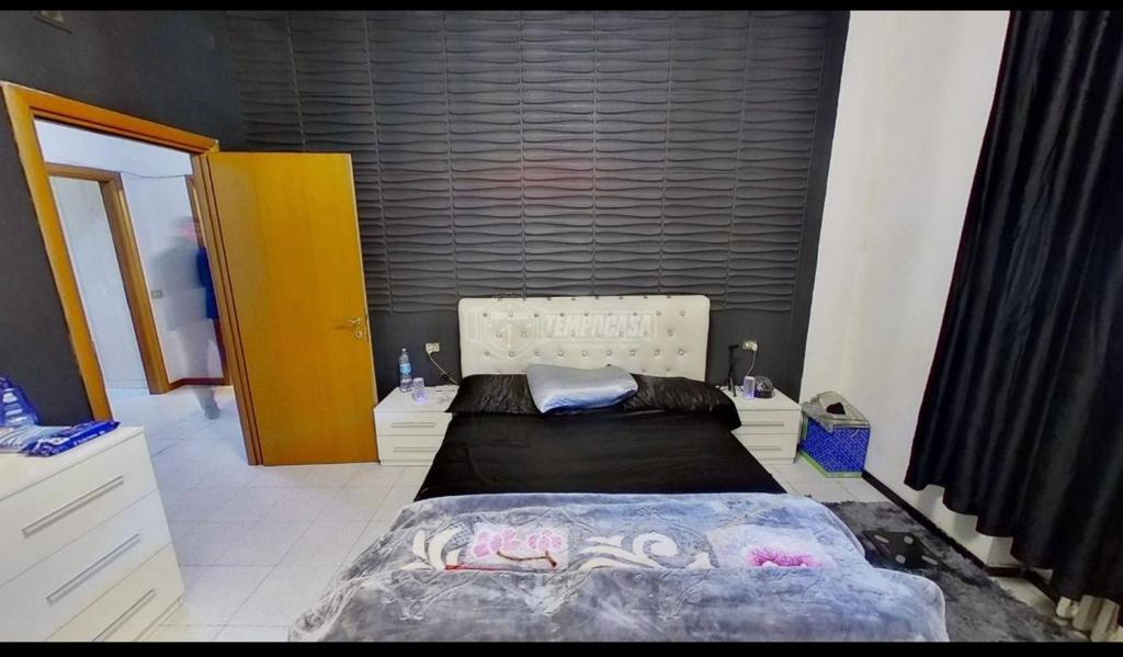 a bedroom with a large bed in a room at private room in Seveso