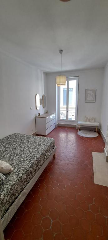 Ένα ή περισσότερα κρεβάτια σε δωμάτιο στο Le Chapelier - Appartement dans l'éccuson