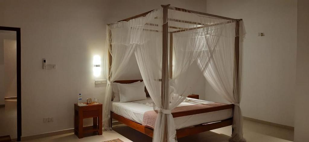 En eller flere senge i et værelse på Green Serene Villa