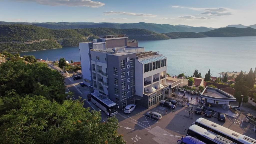 an aerial view of a building next to a body of water at Hotel Jadran Neum in Neum