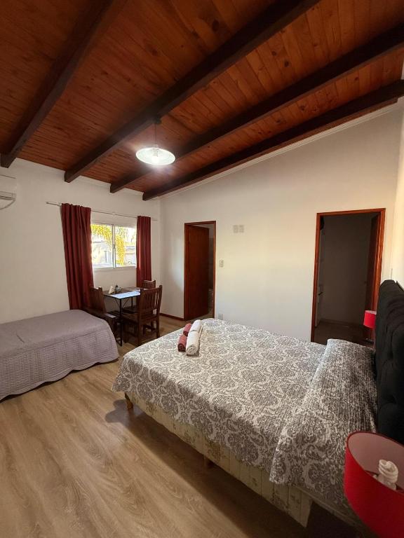 a bedroom with a bed and a table in it at Babela 2 in Concordia