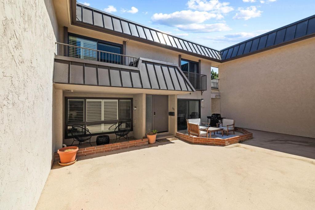 a house with a balcony and a patio at Ocean Breeze Getaway - Solana Beach Condo in Solana Beach