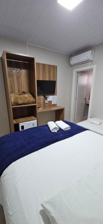 Ένα ή περισσότερα κρεβάτια σε δωμάτιο στο Hotel Querência