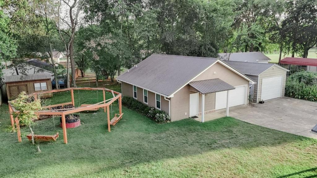 a backyard with a house and a playground at The Alabama Guest House in Englewood