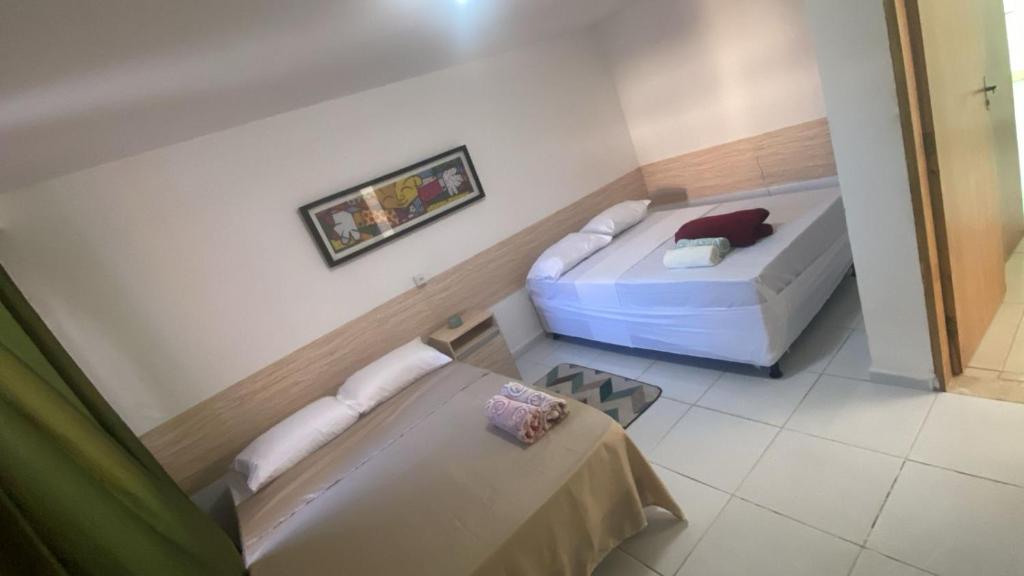 Ένα ή περισσότερα κρεβάτια σε δωμάτιο στο Pousada e Hostel Ponta de Campina