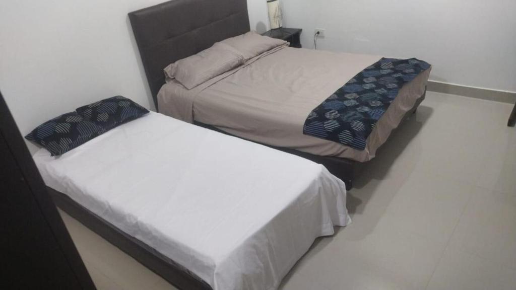 Giường trong phòng chung tại Apartaestudio Suite 201