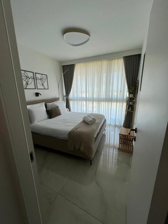 Ένα ή περισσότερα κρεβάτια σε δωμάτιο στο Rose Suite