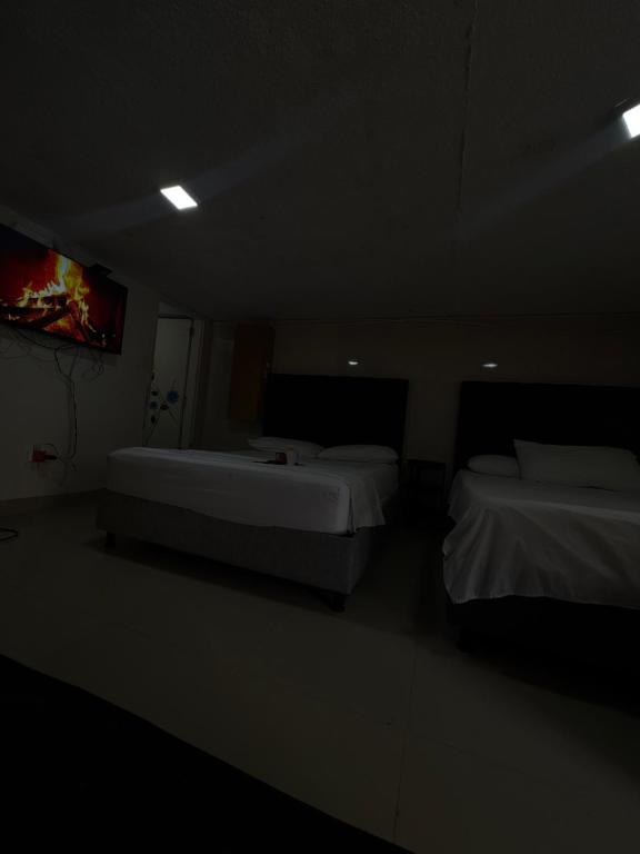 En eller flere senge i et værelse på Habitación corales cerca al mar