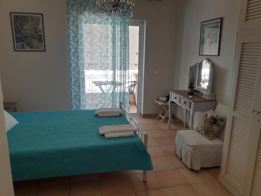 A bed or beds in a room at Foivos Seaside Apartments