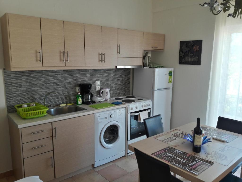 A kitchen or kitchenette at Foivos Seaside Apartments