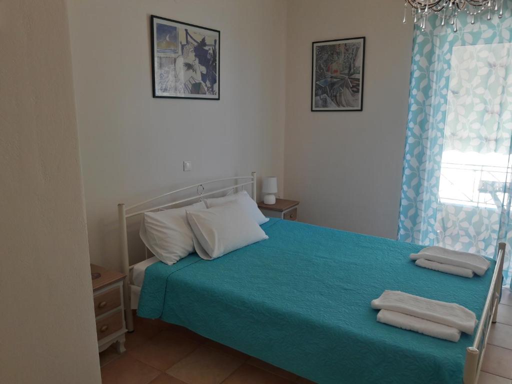 A bed or beds in a room at Foivos Seaside Apartments