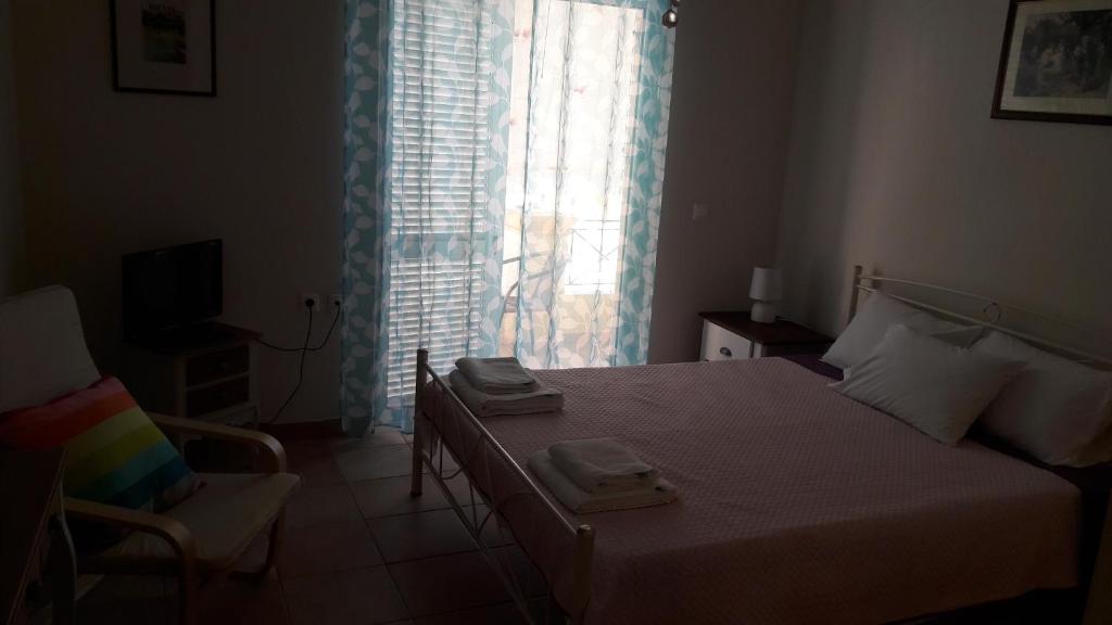 A bed or beds in a room at Foivos Seaside Apartments