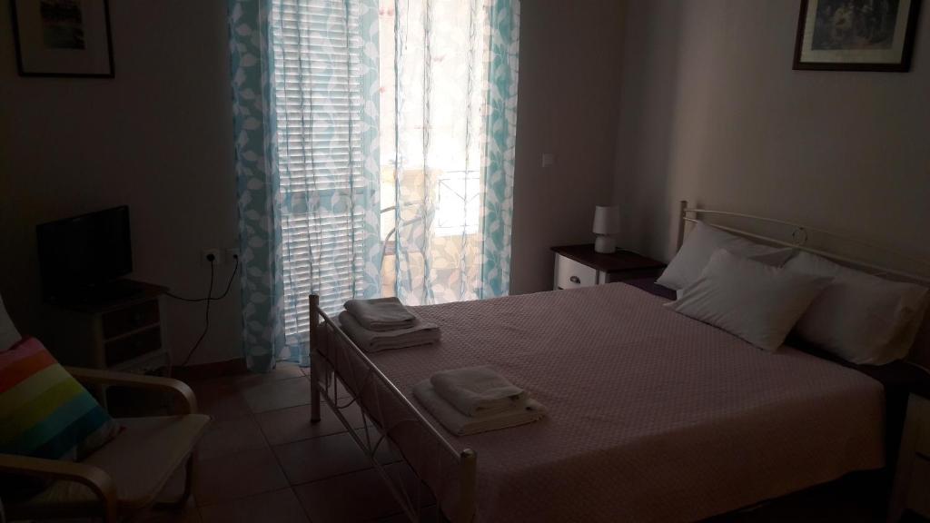 A bed or beds in a room at Foivos Seaside Apartments