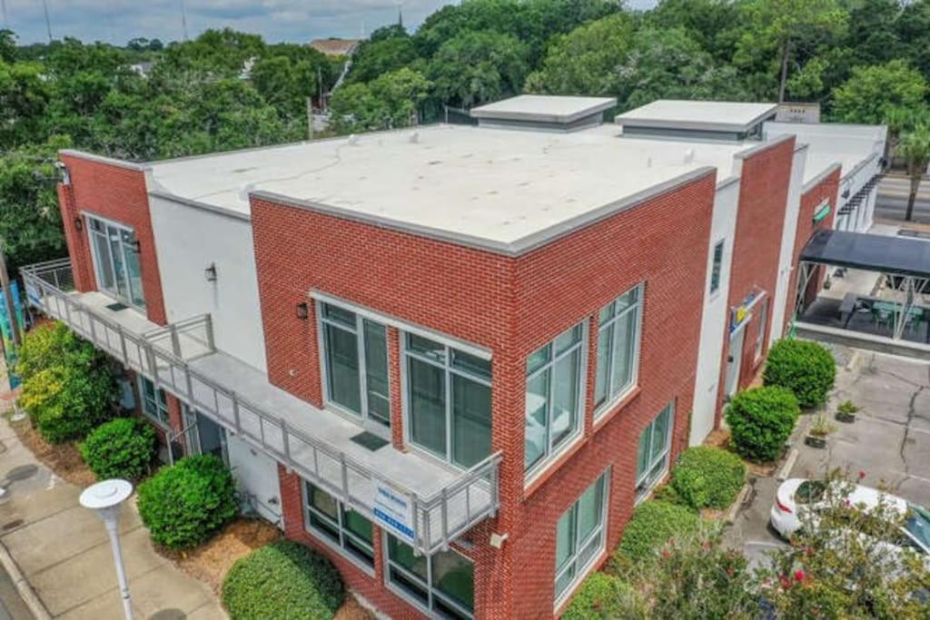 an aerial view of a red brick building at 3 BR 2 BA Downtown Loft water view in Fort Walton Beach