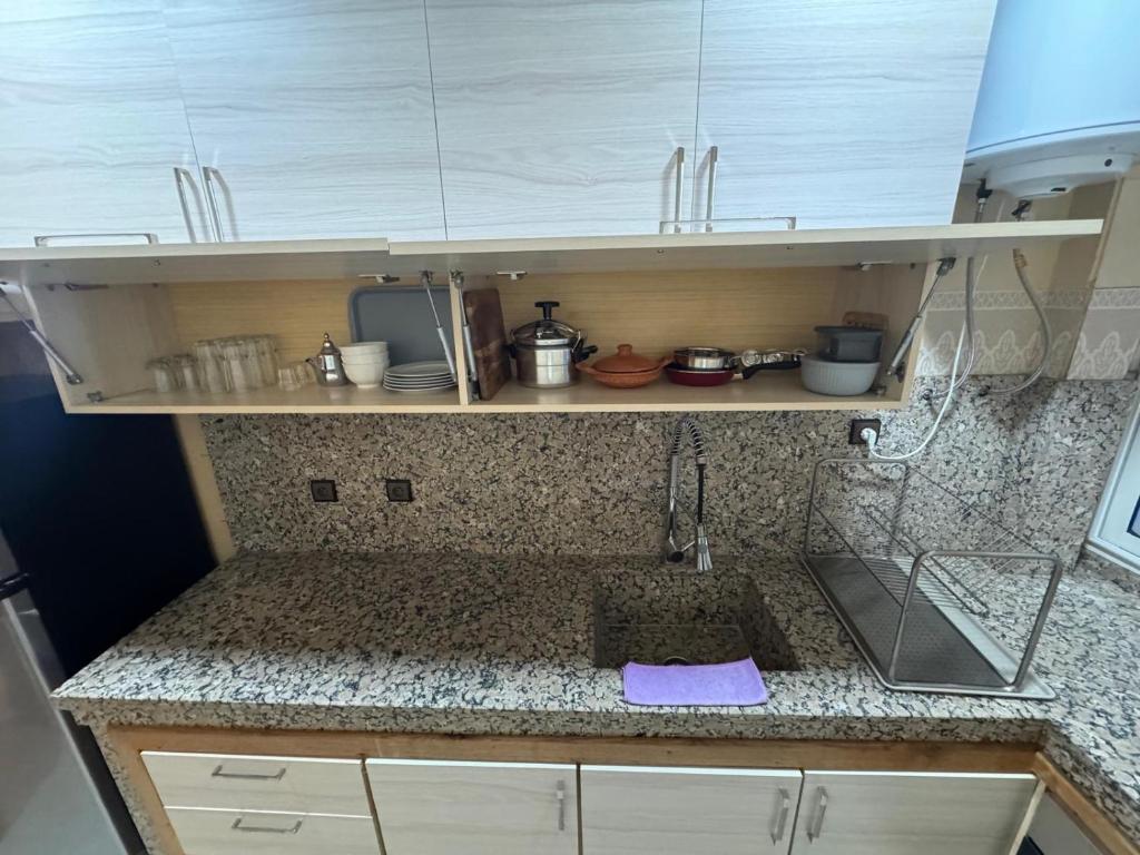 Kuchyň nebo kuchyňský kout v ubytování bel appartement