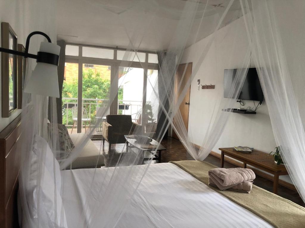 Giường trong phòng chung tại Jardinatta