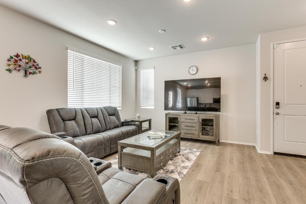 a living room with a couch and a table at Near Hospitals Home with Pool Access in Temecula in Linda Rose