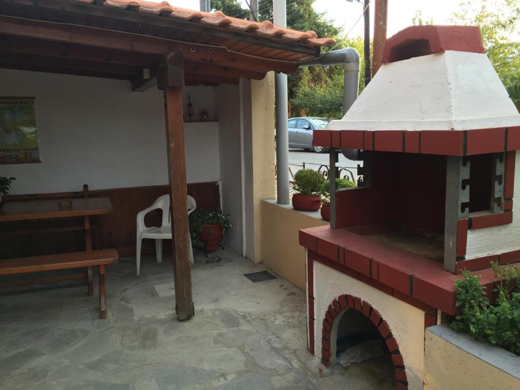 A patio or other outdoor area at Akanthos Hotel
