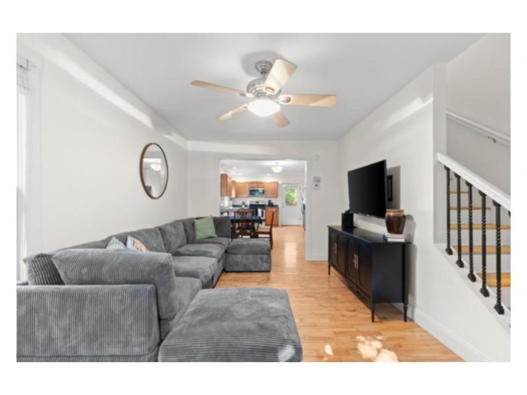 a living room with a couch and a television at New listing! The Terra Cotta Bungalow with Firepit in Athens