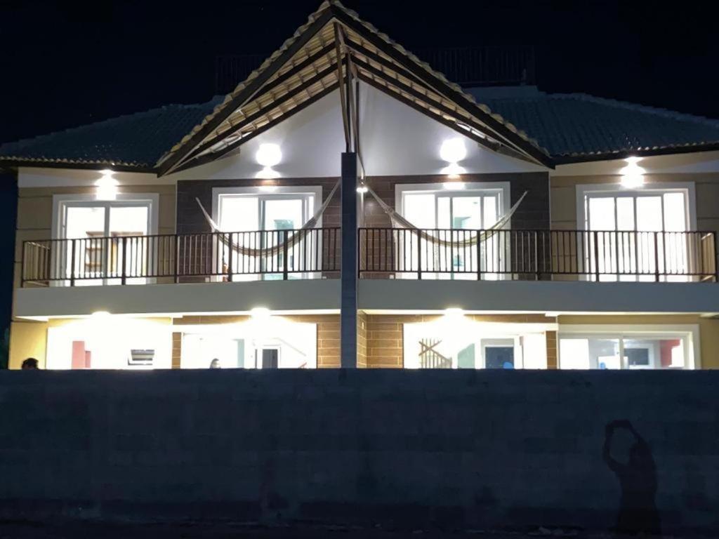 a large building with lights in front of it at Duplex Premium Vista Mar e piscina Canoa Quebrada 12 pessoas in Canoa Quebrada