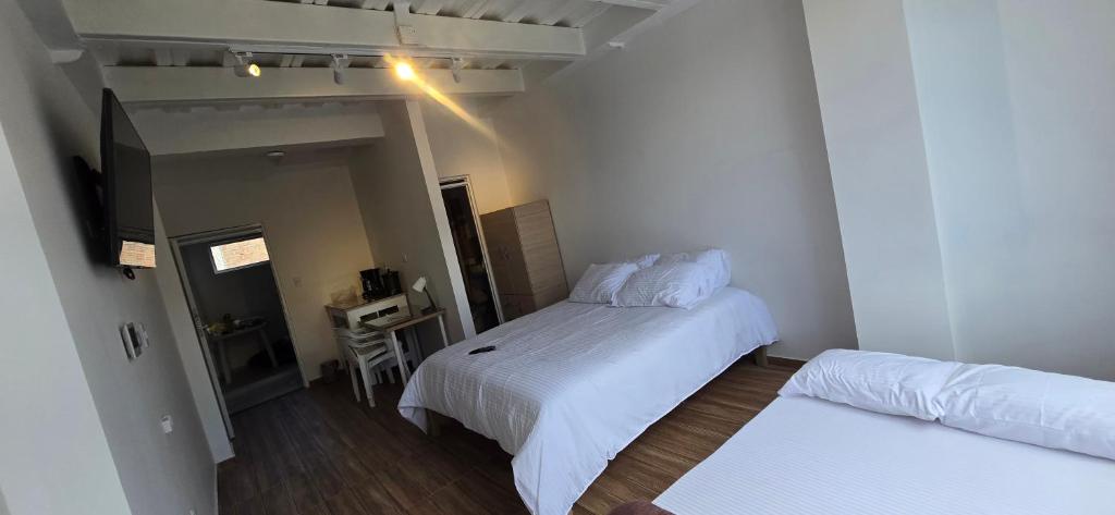 Giường trong phòng chung tại Increíble apartaestudio centro de Pitalito