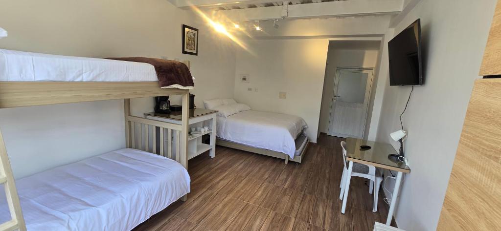 Ένα ή περισσότερα κρεβάτια σε δωμάτιο στο Central y acogedor apartaestudio en Pitalito